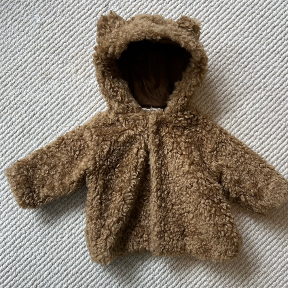 Never worn Babe & Tess baby bear jacket. 6 months.